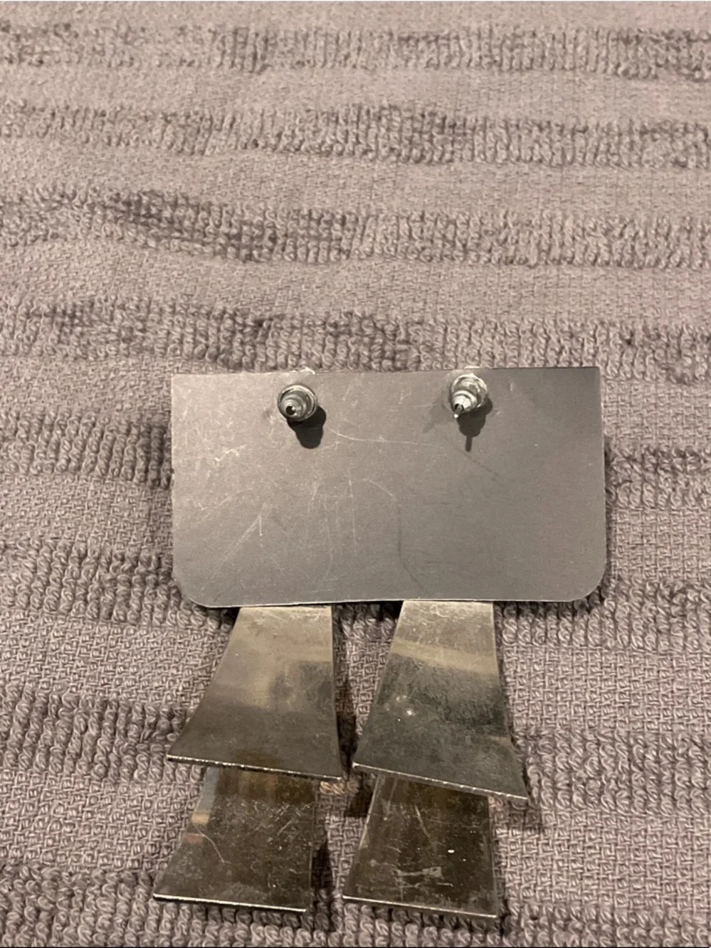 Silver tone earrings.